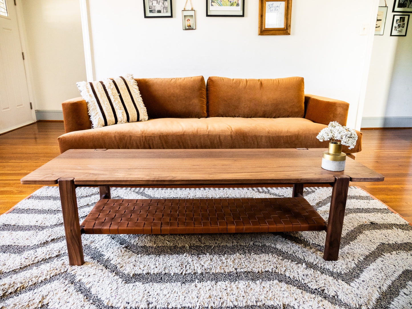 The Milli Coffee Table in Walnut with Leather Shelf
