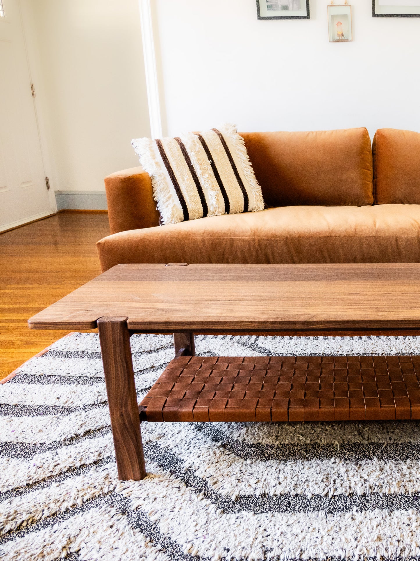 The Milli Coffee Table in Walnut with Leather Shelf