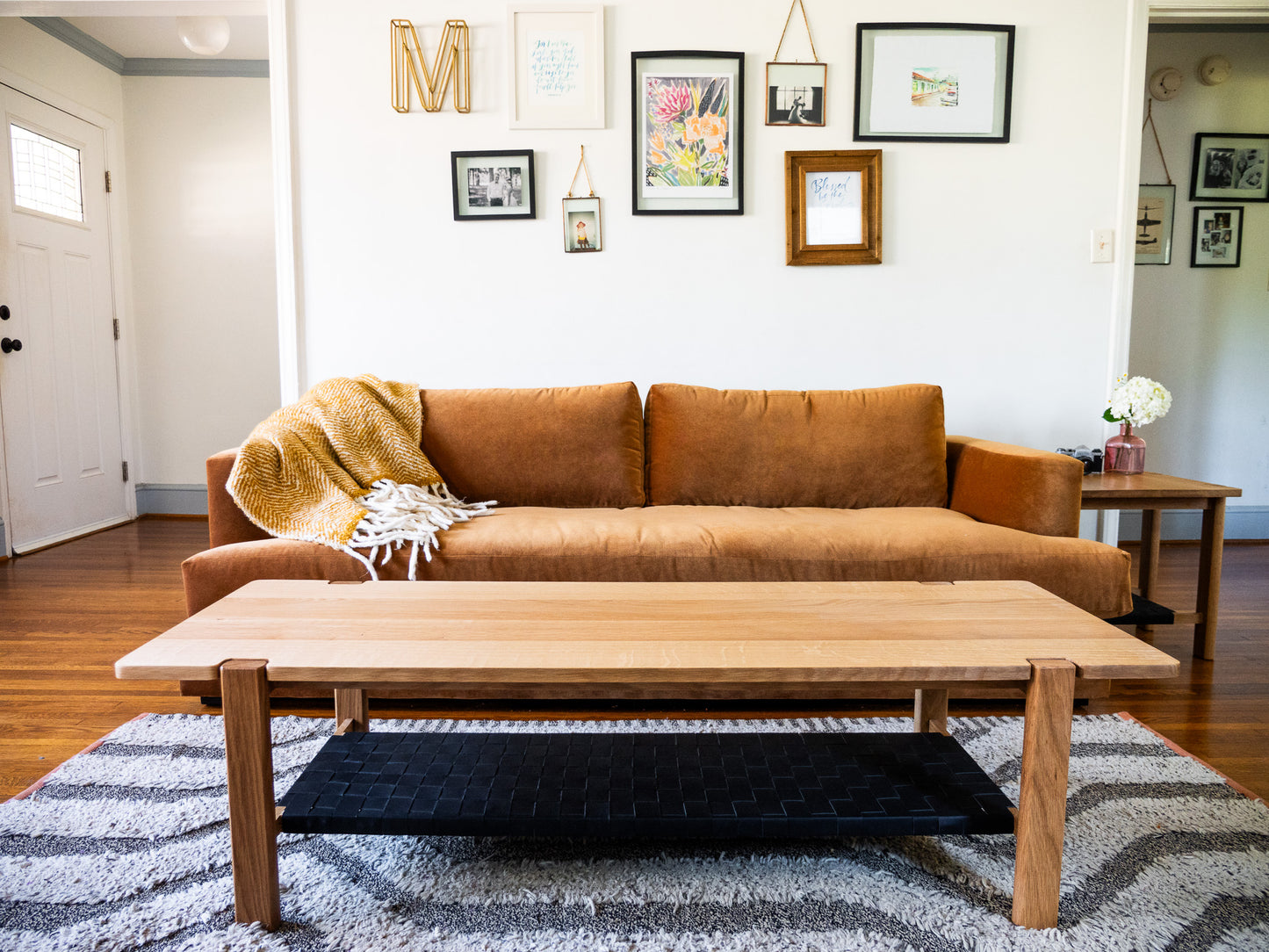 The Milli Coffee Table in White Oak with Leather Shelf (Ready to Ship)
