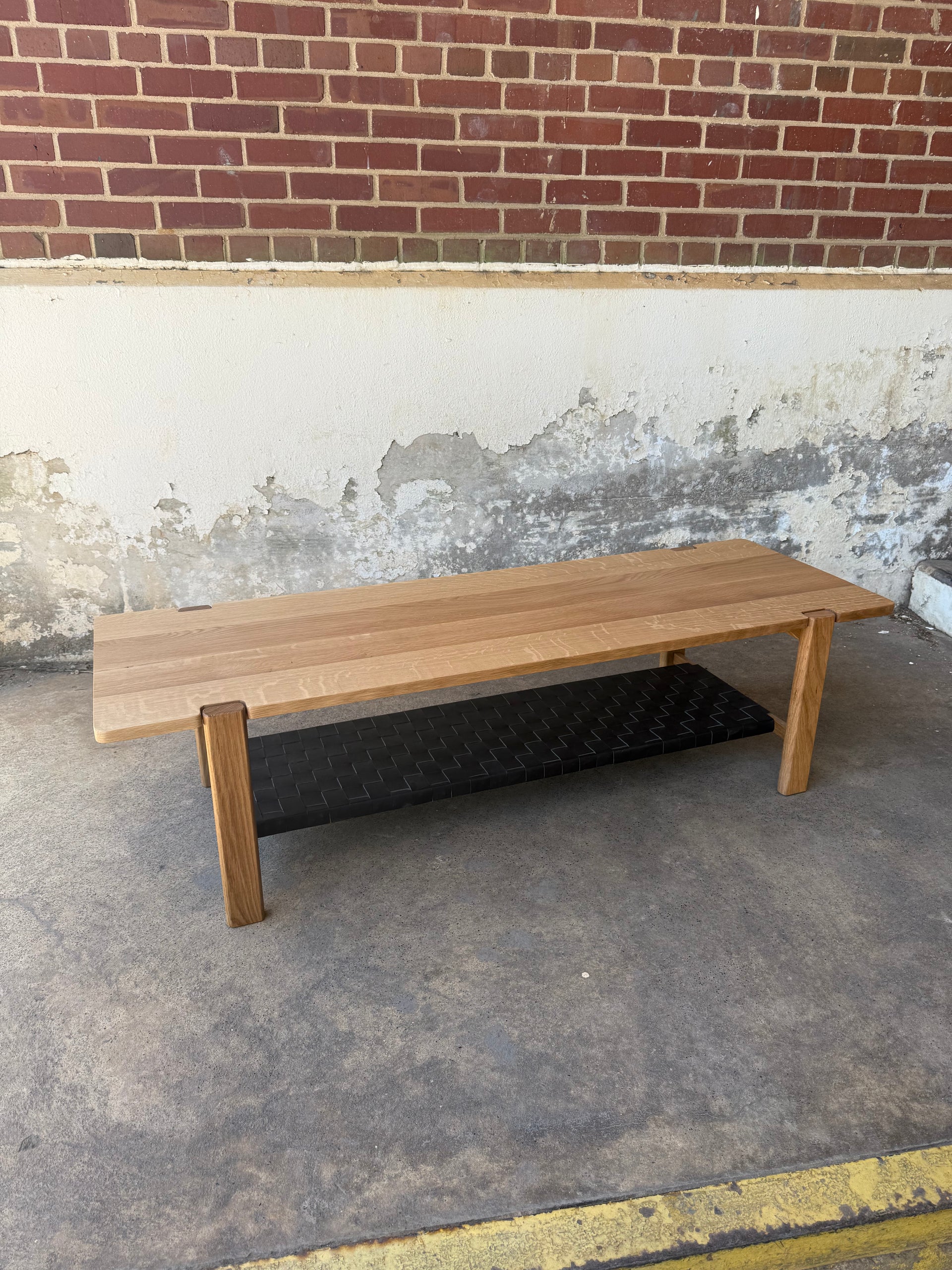 The Milli Coffee Table in White Oak with Leather Shelf (Ready to Ship)