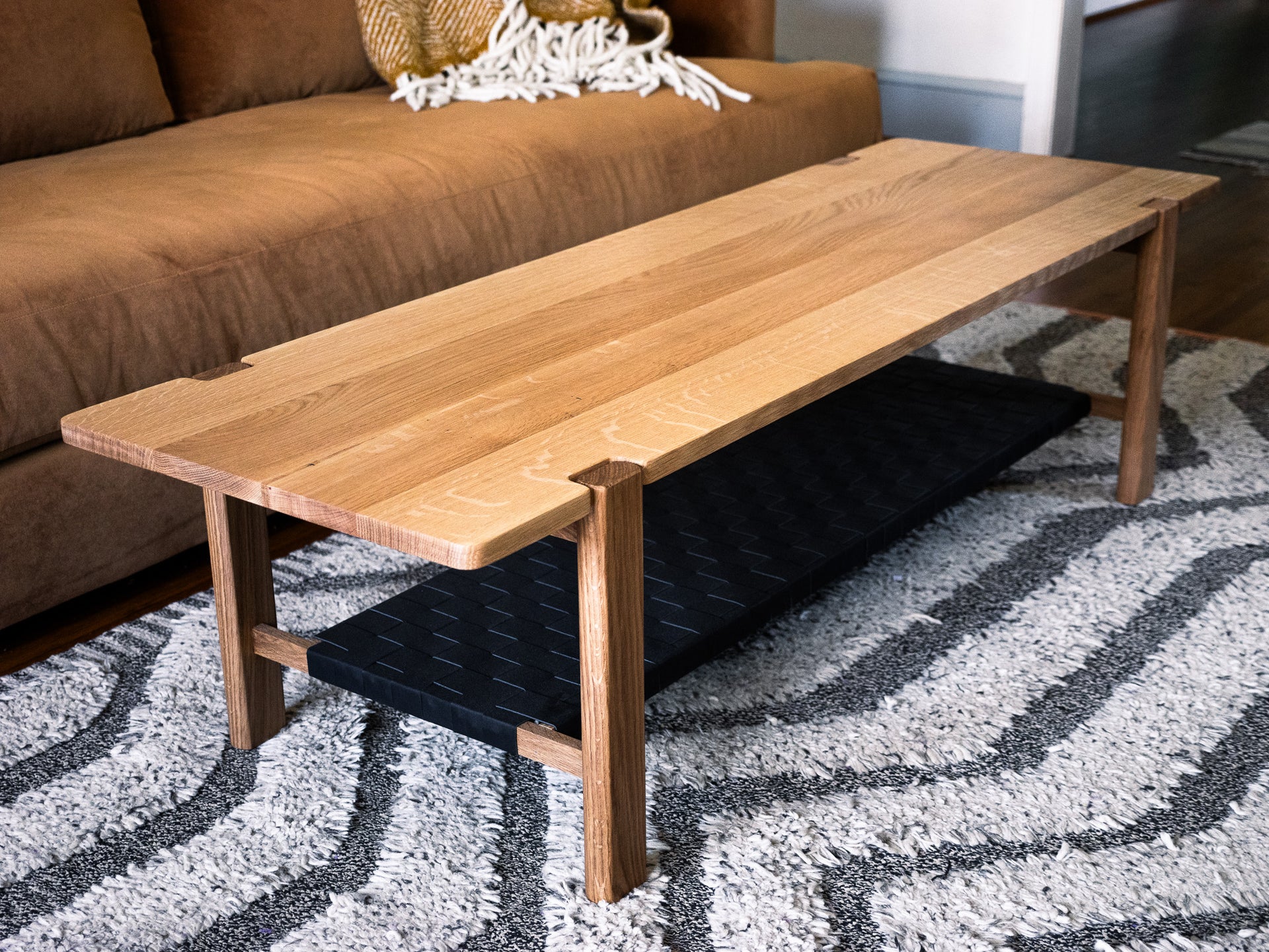 The Milli Coffee Table in White Oak with Leather Shelf (Ready to Ship)